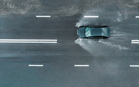 car hydroplaning on highway
